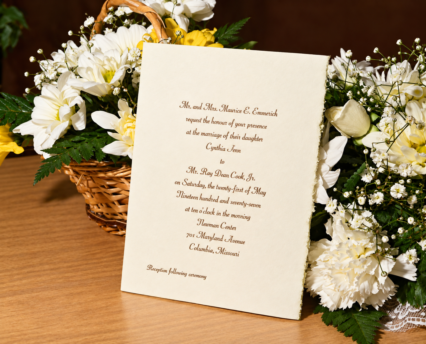 Cindy and Ray’s wedding invitation surrounded by flowers