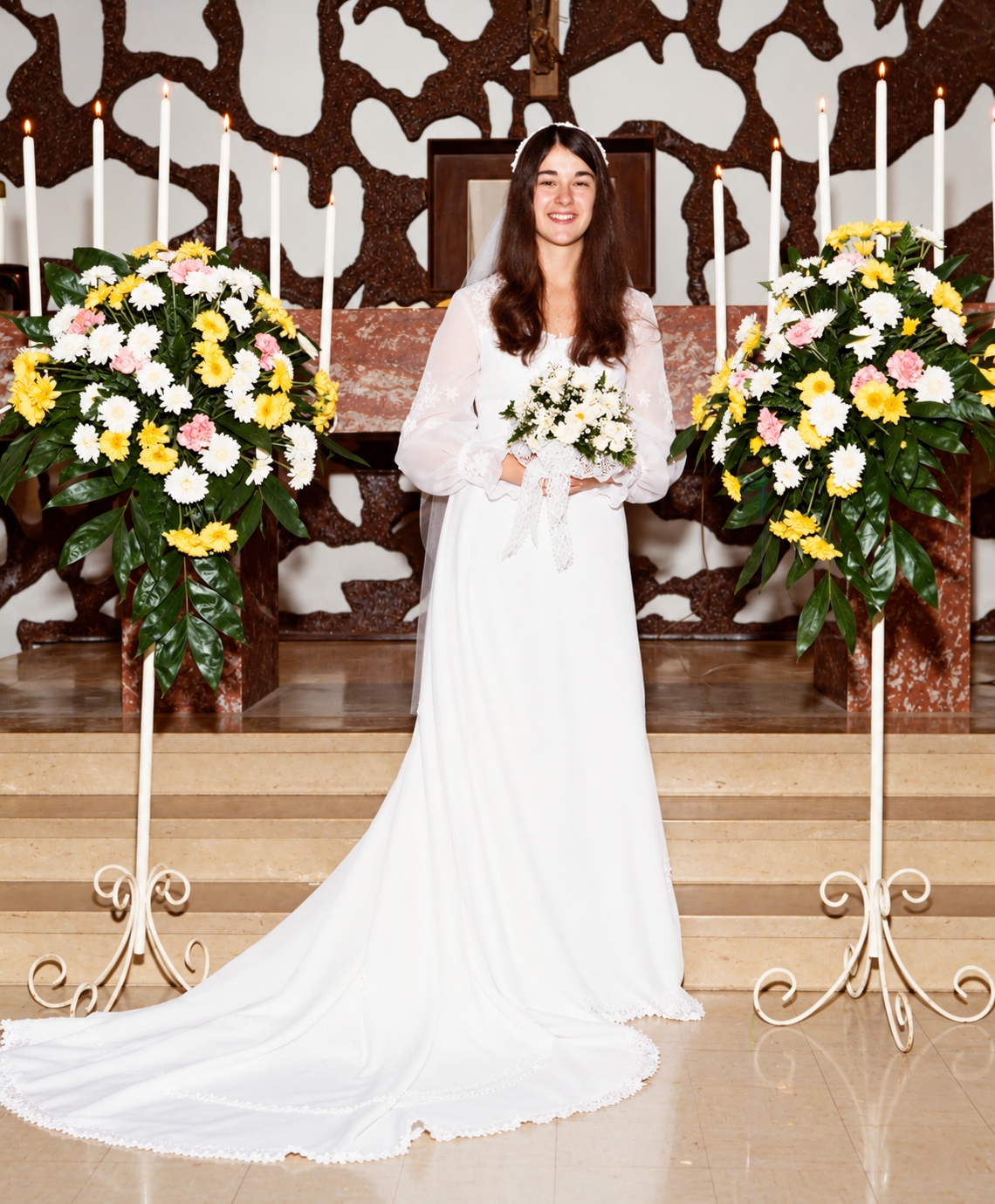 Cindy holding her bouquet in a bridal portrait at the church